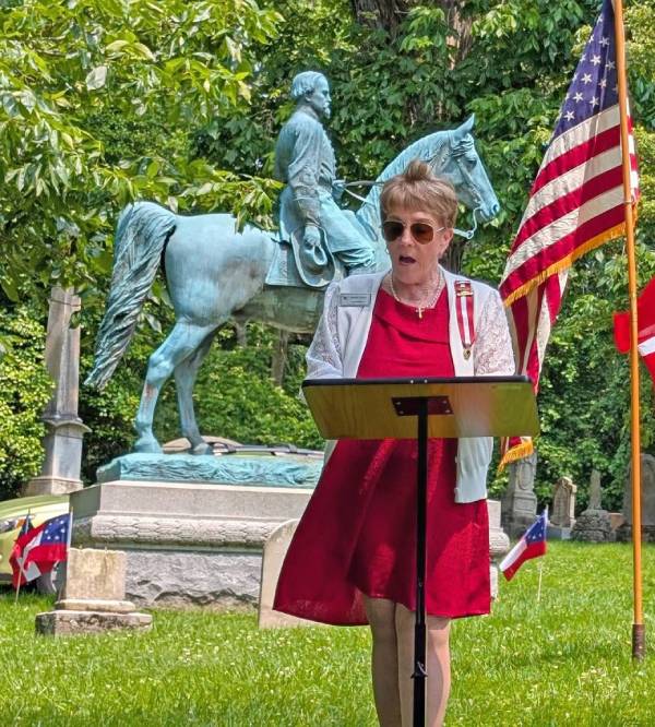 A women in giving speech in United Daughters